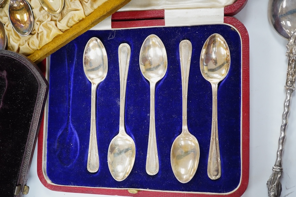 A cased set of twelve late Victorian silver gilt coffee spoons, by Elkington & Co, Birmingham 1890, one other later incomplete set of silver teaspoons and a Victorian cased silver apostle spoon. Condition - fair